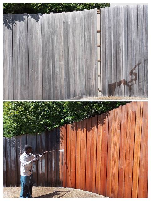 Weathered grey wooden fence restored to warm red-brown, Cape Town